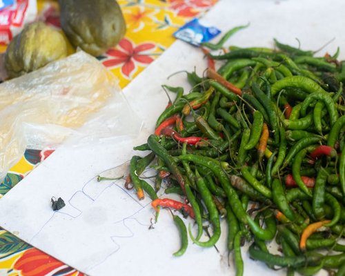 Close up of various colorful Mexican chilies and fresh vegetables